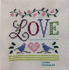 a cross stitch pattern with the words love and birds on it, in different colors