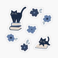 some stickers with cats on them and flowers in the background, including an open book