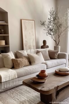 a living room filled with lots of furniture and decor on top of a wooden table