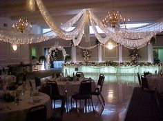 a banquet hall decorated with lights and decorations