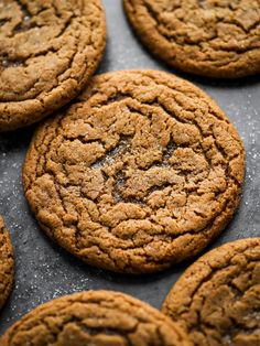 several cookies are sitting on a baking sheet and ready to be baked in the oven