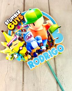 an image of a stick with some cartoon characters on it's top and the words gummy gums