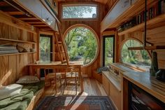 the interior of a tiny house with wood paneling and round windows on both sides