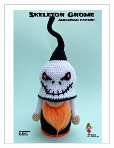 a crocheted stuffed animal with an orange ball in it's mouth and the caption skeleton gnomee