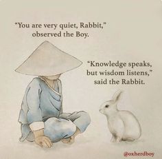 an image of a rabbit sitting next to a person with a hat on their head