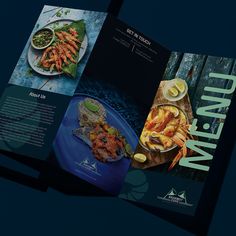 an open brochure with pictures of food on the front and back pages in blue