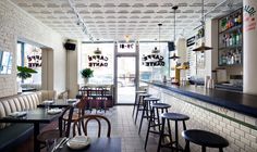 the inside of a restaurant with tables, chairs and signs on the walls that say caffe dante