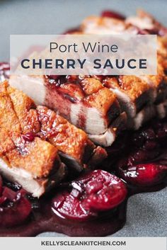 a close up of food on a plate with text that reads port wine cherry sauce