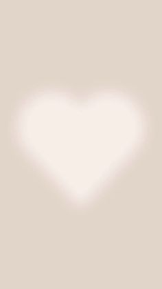 a white heart shaped object on a light gray background with the word love written below it