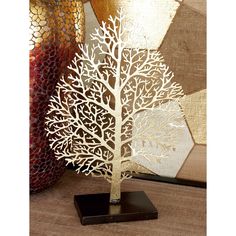 a white paper cutout of a tree on a table