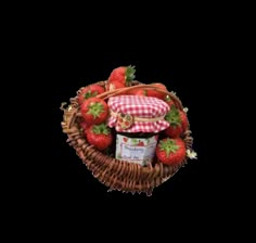 strawberries and jam in a basket with gingham checker hat on top