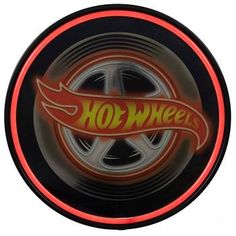 a neon sign with the word hot wheels on it's center circle and flames