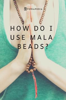 a woman with her hands folded in prayer and the words how do i use mala beads?