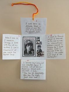 two pieces of paper with pictures on them hanging from a wall next to a note attached to a string