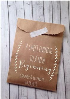 a brown paper bag with the words, sweet ending to a new beginning on it