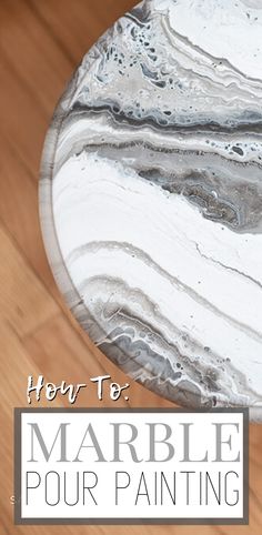 marble table with text overlay that says, hey to marble pour painting on it