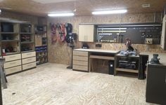 a garage with lots of workbenches and tools