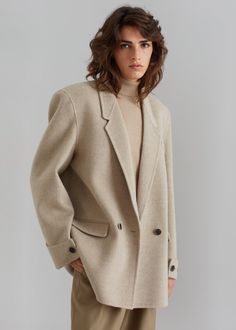 Color: BeigeMidweight wool blend fabric Boxy silhouetteNotch lapelPadded shouldersSingle illusion welted breast pocketRolled button cuffsFront flap pocketsVented backFront button closurePartially lined 90% Wool 10% PolyamideDry Clean Imported Double Button Notch Lapel Wool Coat For Work, Semi-formal Beige Wool Outerwear, Beige Wool Coat With Lapel Collar, Chic Business Wool Coat With Pockets, Business Blazer With Concealed Placket In Beige, Office Wool Coat With Welt Pockets, Office Wool Coat With Welt Pockets And Long Sleeves, Classic Beige Blazer With Concealed Placket, Single Button Wool Coat With Lapel Collar For Business