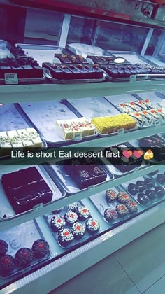 a display case filled with lots of different types of desserts