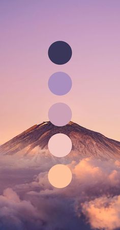 the sky is filled with clouds and there are five circles in front of a mountain