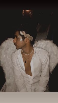 a man with angel wings on his head