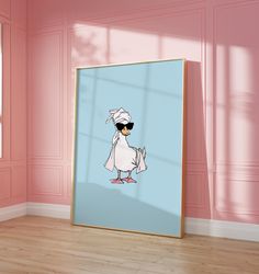 a framed photo of a cartoon duck wearing sunglasses and a chef's hat, standing in front of a pink wall