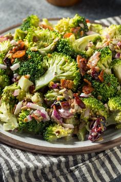 a plate full of broccoli salad with bacon