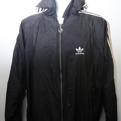 Rare 90's Vintage "Adidas" Puffy Fall/Winter Reversible Windbreaker Jacket With Hoodie (Men's Exclusive) - Marked Size: X-Large - Condition: Very Good - Material: Shell- 100% Nylon, Lining- 25% Rayon, 75% Polyester - Color: Black & White Measurements (In Inches): Length: 29" Armpit To Armpit: 31" Bust (2x): N/A Shoulders (Shoulder To Shoulder): 23" Sleeve: 25" ***Only 1 Available In All Of Our Stores*** Jacket With Hoodie, Adidas Jackets, Reversible Jacket, Vintage Adidas, Only 1, Windbreaker Jacket, Black Adidas, Hoodie Jacket, Adidas Men