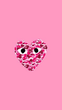 a heart made out of pink camo on a pink background with eyes in the middle