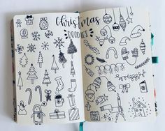 an open notebook with christmas doodles on it