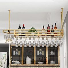 a bar with wine glasses and bottles on it