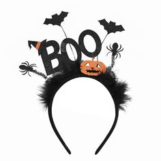 a black headband with halloween decorations and bats on the top is decorated with boo