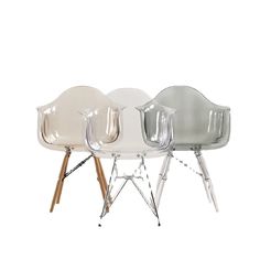 three plastic chairs sitting next to each other