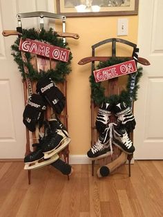 two snowboarders are sitting on their sleds in front of the door