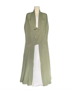 Soft lightweight pastel green long abaya kaftan cape with v-shaped neck, may also be worn as an open abaya. Front open ribbon closure robe/cape/stole with wide curved sleeves and nice flare for a flowy and stylish look and ease of walking. A nice touch to your simple abaya or suit look. Fabric and style suitable for all occasions and weather conditions. Abaya kaftan cape may be worn with any color abaya or salwar or dress suit of your choice. Available in size 54. This item comes as cape ONLY, it does not come with under abaya as shown in images. (You may purchase linen abayas separately of your color choice from the shop to pair with this cape.) Simple Abaya, Open Abaya, Pistachio Green, Pastel Green, Wide Sleeves, Head Covering, Dress Suits, Front Open, V Shape