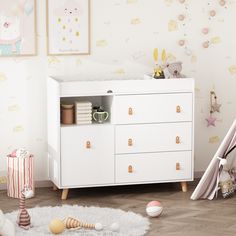 a baby's room with a crib and toys on the floor