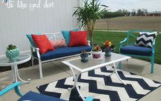 an outdoor patio with blue and white furniture