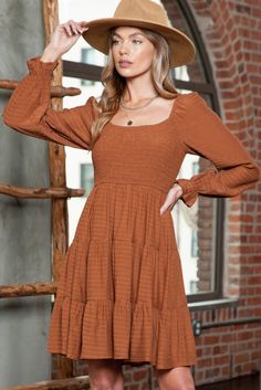 Material:50%Polyester+50%Viscose It features a smocked bodice for a flattering fit. Long sleeves add warmth and versatility. Can be styled with ankle boots and a wide-brim hat for a bohemian look. Size Chart (CM) Sizes Bust Waist Sleeve_Length Length Relax Relax Relax Relax S 68 63 67 87 M 74 69 68 89 L 80 75 69 91 XL 88 83 70 93 Elasticity None Size Chart (INCH) Sizes Bust Waist Sleeve_Length Length Relax Relax Relax Relax S 26.8 24.8 26.4 34.3 M 29.1 27.2 26.8 35.0 L 31.5 29.5 27.2 35.8 XL 34.6 32.7 27.6 36.6 Elasticity None Fall Fitted Smocked Top With Ruffles, Fitted Smocked Top With Ruffles For Fall, Fall Square Neck Smocked Top With Ruched Detail, Fall Smocked Dress With Ruffles And Square Neck, Fall Square Neck Ruched Smocked Top, Chic Smocked Midi Dress For Fall, Casual Smocked Dress With Elastic Sleeves And Square Neck, Casual Smocked Dress With Square Neck And Elastic Sleeves, Fall Smocked Top With Square Neck