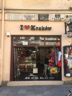 a woman standing in the doorway of a store