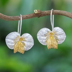 Embellished with 18k gold, these gleaming orchid earrings are pure luxury. Designed by Lalana, the drop earrings are hand crafted by Thai artisans, who use sterling silver to create the floral motif. An 18k gold-plated petal centers the pair, shimmering beautifully. Thailand Gifts, Orchid Earrings, Petite Earrings, Earrings Golden, Sterling Silver Drop Earrings, Tiny Earrings, Large Earrings, Small Earrings, Silver Drop Earrings