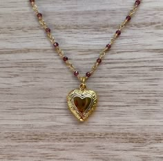 This dainty necklace is handcrafted using a 2mm authentic garnet wire-wrapped chain and a 11mm heart pendant. The chain and pendant are 24k gold plated.  This necklace is hypoallergenic. (Cadium free, lead free, and nickel safe) Garnet is an energizing stone that promotes passion and love.  The necklace comes in a ribbon-wrapped box, ready to be gifted. If you would like to leave a note for the recipient, you can do so during checkout. 90s Inspired Jewelry, Gold Cameo Necklace, Gold And Garnet Jewelry, Romantic Jewelry Aesthetic, Garnet Pendant Necklace, Vintage Necklace Gold, Vintage Garnet Jewelry, Hispanic Necklace, Good Necklace Jewellery