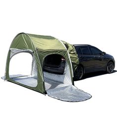 a car is parked next to a tent