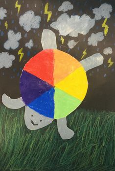 a child's drawing of a turtle in the grass with lightning and rain clouds