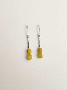 Rhodium-Plated Silver & Opaque Yellow Amber Dangle Hook Earrings, beautifully handcrafted with carefully selected natural baltic amber. Only genuine baltic amber pieces are set in rhodium-plated sterling silver to create exclusive and timeless jewellery. => Offered directly by the manufacturer => Almost 35 years of Expertise, Quality, Craftsmanship and Innovations Size (LxWxH): 55x8x6mm Stone shape: irregular shape Stone quantity: 2 pcs. per earring Stone size: approx. 8x9mm Amber colour: opaque yellow Total weight: 5.2g Please check our collection for matching items! -=-=-=-=-=-=-=-=-=-=-=-=-=-=-=-=-=-=-=-=-=-=-=-=-=-=-=-=-=-=-=-=-=-=-=-=-=- Dear Customers, please note that all our jewellery is handcrafted using only high quality and natural materials. Each amber piece is different, uniqu Timeless Jewellery, Amber Gemstone, Amber Earrings, Amber Color, Timeless Jewelry, Baltic Amber, Hook Earrings, Stone Earrings, Rhodium Plated