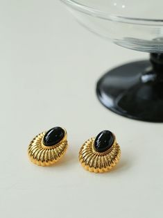 Carefully crafted to exude a sense of sophistication, each earring features a polished black onyx gemstone. The deep, rich hue of the onyx contrasts beautifully with its vintage-style setting, enhancing its natural beauty. Whether worn for a formal occasion or elevating an everyday look, these earrings are perfect for adding a touch of sophistication to any outfit. Metal: 18K Recycled Gold Plated On Brass/Recycled Sterling Silver Plated On Brass /925 Sterling Silver Ear Needle Gemstone: Black On Black Onyx Earrings, Edison Pearls, Onyx Earrings, Onyx Gemstone, Tiger Eye Stone, Recycled Gold, Jewellery Designs, Recycled Sterling Silver, Elegant Earrings