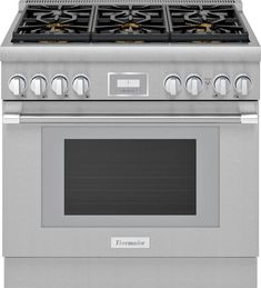 a stainless steel oven with four burners