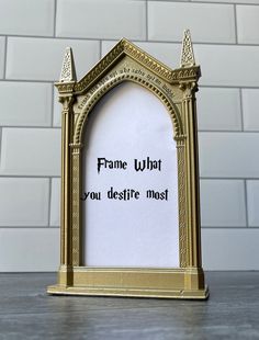 a gold frame with the words frame what you destire most written on it