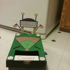 a cardboard box shaped like a baseball field