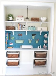 an organized craft room with shelves and baskets