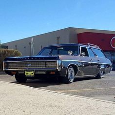 an old car parked in front of a target store